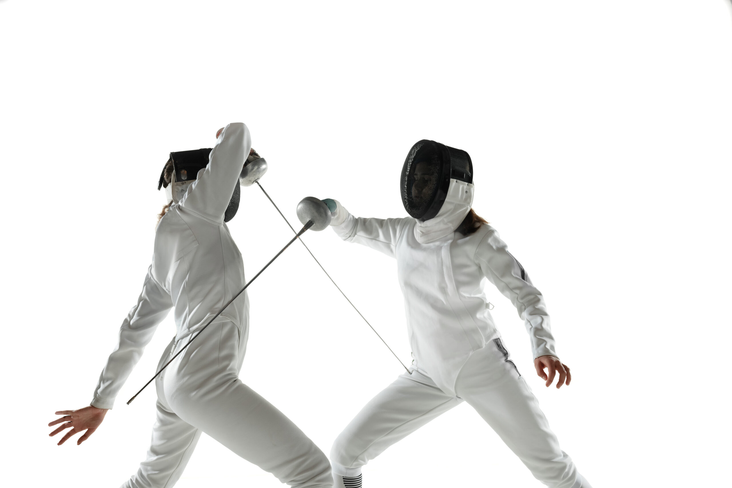 girls-in-fencing costumes with swords in hands isolated on white background